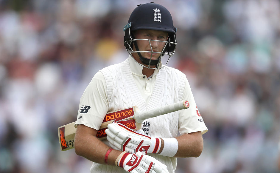 England's Joe Root leaves the pitch after being caught by South Africa's Quinton de Kock, who dived to his right and took a one-handed catch. AP