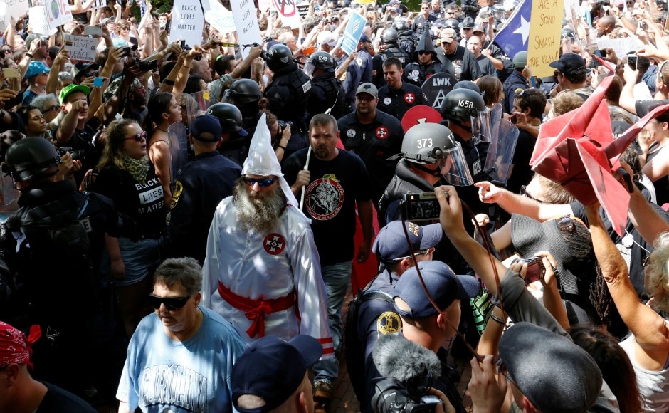 Supporters of white supremacist group Ku Klux Klan marched in Charlottesville, Virginia on Saturday to protest the planned removal of a statue of General Robert E Lee, who oversaw Confederate forces in the US Civil War. Reuters Supporters of white supremacist group Ku Klux Klan marched in Charlottesville, Virginia on Saturday to protest the planned removal of a statue of General Robert E Lee, who oversaw Confederate forces in the US Civil War. Reuters