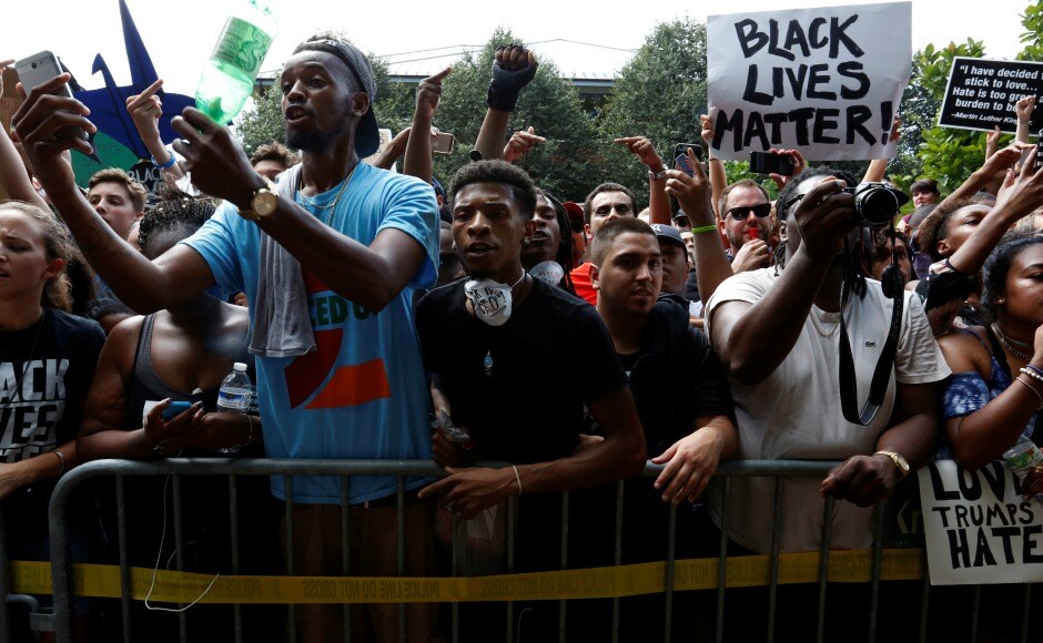 The Klan marchers were met by hundreds of jeering counter-protesters in this quiet university town, where the protest by the notorious white power group was authorised by officials in Virginia on free speech grounds. Reuters The Klan marchers were met by hundreds of jeering counter-protesters in this quiet university town, where the protest by the notorious white power group was authorised by officials in Virginia on free speech grounds. Reuters