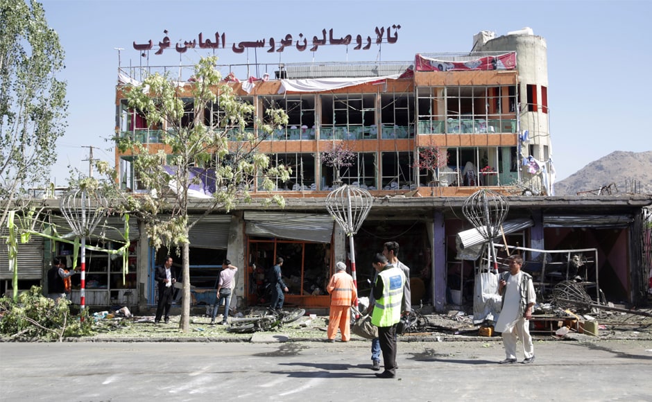 Municipality workers clean up in front of a wedding hall at the site of the attack in Kabul. The Taliban claimed responsibility for the blast, which came just before 7 am. The group rarely claims attacks with high civilian casualties but does frequently target government employees. AP Municipality workers clean up in front of a wedding hall at the site of the attack in Kabul. The Taliban claimed responsibility for the blast, which came just before 7 am. The group rarely claims attacks with high civilian casualties but does frequently target government employees. AP