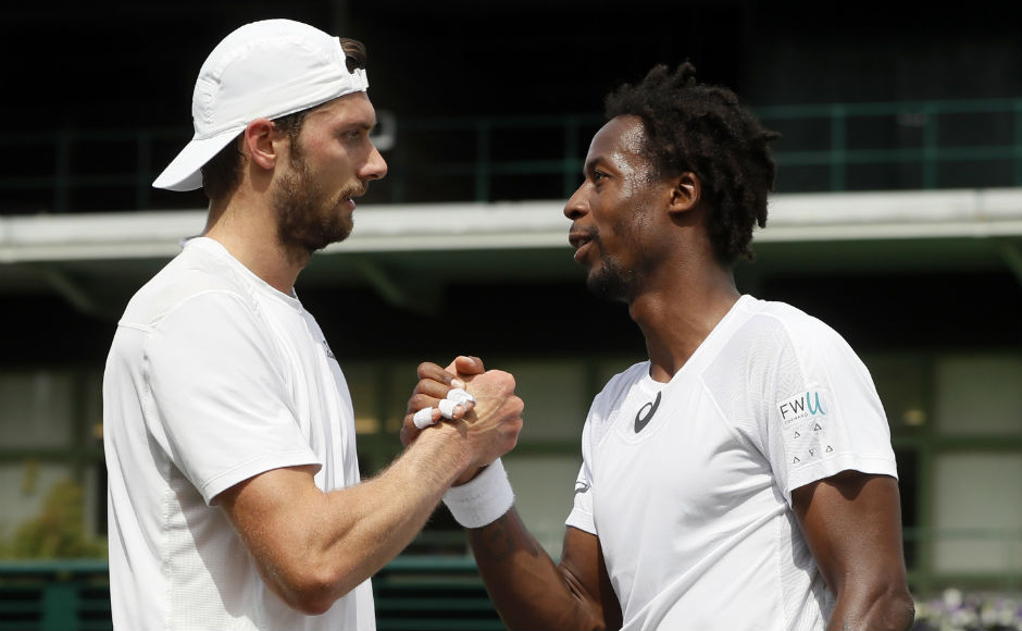 Gael Monfils shakes hands with Germany's Daniel Brands after beating him in their men's singles match on day two. AP Gael Monfils shakes hands with Germany's Daniel Brands after beating him in their men's singles match on day two. AP