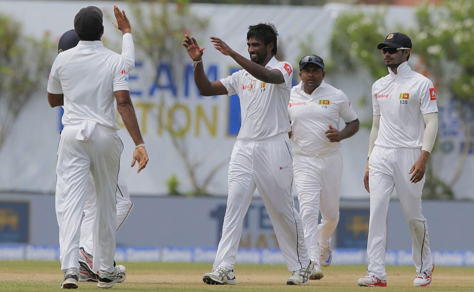 Sri Lanka's Nuwan Pradeep celebrates the dismissal of India's Cheteshwar Pujara. AP