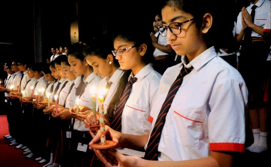 In Surat, school students paid tribute by praying and lighting candles for the victims. PTI In Surat, school students paid tribute by praying and lighting candles for the victims. PTI