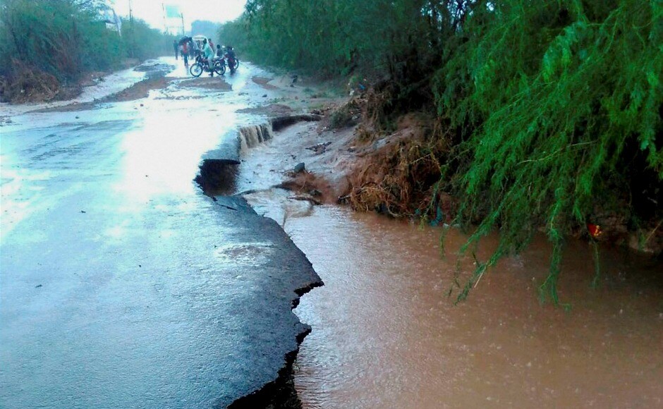 Heavy rains in Gujarat have led a deluge-like situation at several places, damaging roads and cutting power. PTI Heavy rains in Gujarat have led a deluge-like situation at several places, damaging roads and cutting power. PTI