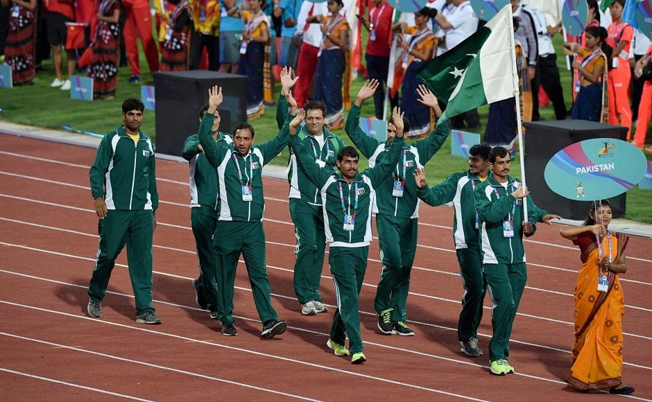 Pakistani athletes march past during the opening ceremony. PTI Pakistani athletes march past during the opening ceremony. PTI