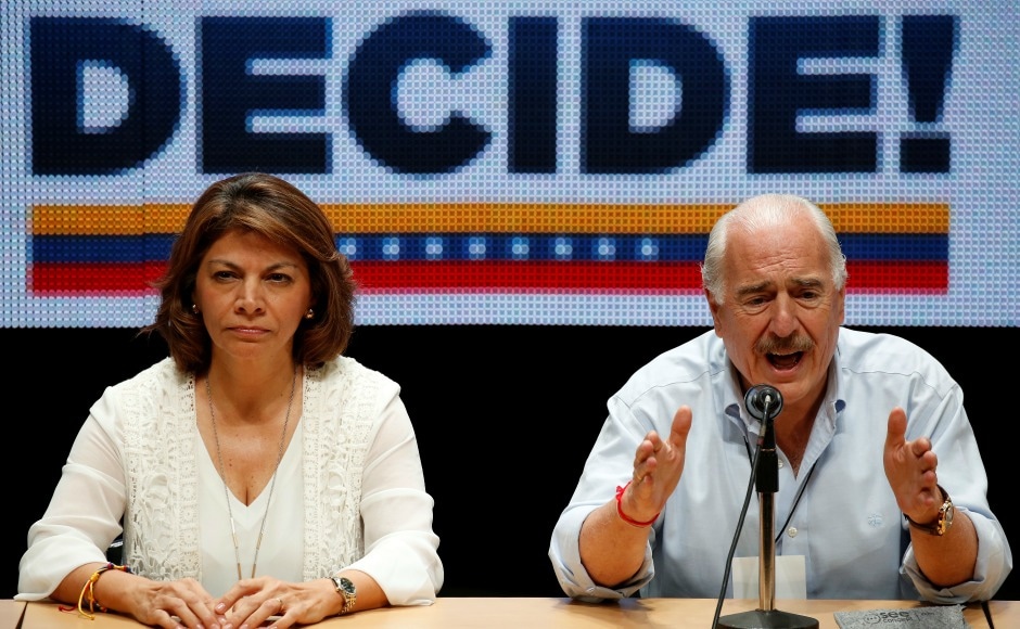 Former Colombian president Andres Pastrana (R) addresses the audience next to former Costa Rican president Laura Chinchilla. The event appeared to rejuvenate the Opposition amid weariness with street protests, but it is unlikely to lead to a change of government in the short term. Reuters Former Colombian president Andres Pastrana (R) addresses the audience next to former Costa Rican president Laura Chinchilla. The event appeared to rejuvenate the Opposition amid weariness with street protests, but it is unlikely to lead to a change of government in the short term. Reuters