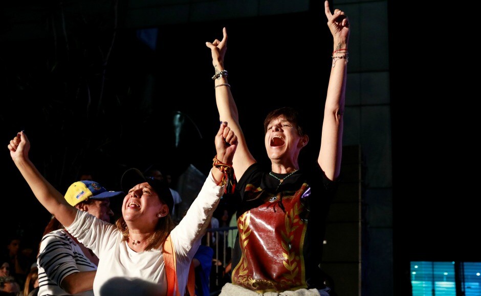 Despite the vote not being recognised, a festive atmosphere reigned in most cities, with people chanting "Yes we can!" Music was played aloud, car horns were honked, and Venezuelan flags were waved. Reuters Despite the vote not being recognised, a festive atmosphere reigned in most cities, with people chanting "Yes we can!" Music was played aloud, car horns were honked, and Venezuelan flags were waved. Reuters