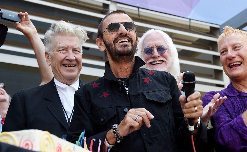 Starr, center, is joined by guests including filmmaker David Lynch, left, and musician Edgar Winter, second from right. Photo by AP Starr, center, is joined by guests including filmmaker David Lynch, left, and musician Edgar Winter, second from right. Photo by AP
