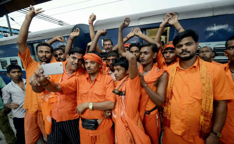 Kanwariyas, Shiva devotees on annual pilgrimage, take selfie after deboarding a train at Mirzapur in Uttar Pradesh. PTI Kanwariyas, Shiva devotees on annual pilgrimage, take selfie after deboarding a train at Mirzapur in Uttar Pradesh. PTI