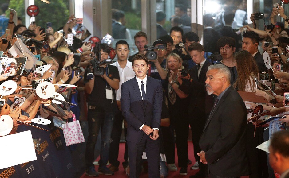 Actor Tom Holland, center, is greeted by fans during a promotional event for his latest film Spider-Man: Homecoming in Seoul, South Korea, Sunday, 2 July, 2017. The film will be released in South Korea on 5 July. (AP Photo/Ahn Young-joon) Actor Tom Holland, center, is greeted by fans during a promotional event for his latest film Spider-Man: Homecoming in Seoul, South Korea, Sunday, 2 July, 2017. The film will be released in South Korea on 5 July. (AP Photo/Ahn Young-joon)