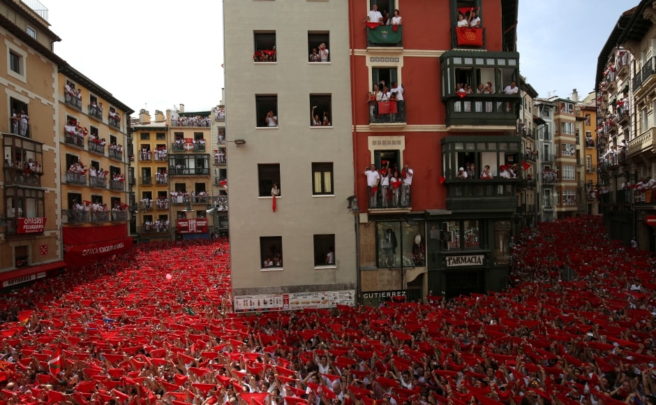 The launch of the traditional firework rocket known as the "Chupinazo" kicks of the festival. The firework is launched from Pamplona's town hall balcony at noon to the delight of thousands of people packed into the square below. The festival's typical dress is white clothes and red neck scarves. Reuters The launch of the traditional firework rocket known as the "Chupinazo" kicks of the festival. The firework is launched from Pamplona's town hall balcony at noon to the delight of thousands of people packed into the square below. The festival's typical dress is white clothes and red neck scarves. Reuters