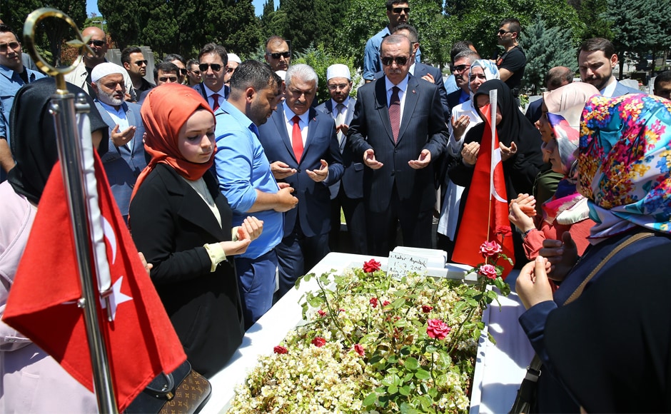 Erdogan (centre) and Turkey's prime minister Binali Yildirim, (centre left) attend a prayer by the grave of a victim of the failed coup attempt, in Istanbul on Tuesday. Erdogan once described the coup as a "gift from God" that had allowed the government to purge the military and public institutions of the 'Gulenists' who once were allied with his Islamic-rooted Justice and Development Party. AP Erdogan (centre) and Turkey's prime minister Binali Yildirim, (centre left) attend a prayer by the grave of a victim of the failed coup attempt, in Istanbul on Tuesday. Erdogan once described the coup as a "gift from God" that had allowed the government to purge the military and public institutions of the 'Gulenists' who once were allied with his Islamic-rooted Justice and Development Party. AP