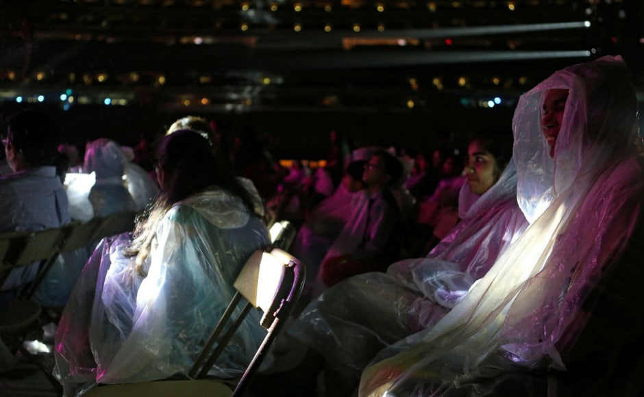 Concertgoers wear ponchos to protect against the rain while attending the International Indian Film Academy Rocks show at MetLife Stadium in East Rutherford, New Jersey, U.S. (Reuters) Concertgoers wear ponchos to protect against the rain while attending the International Indian Film Academy Rocks show at MetLife Stadium in East Rutherford, New Jersey, U.S. (Reuters)