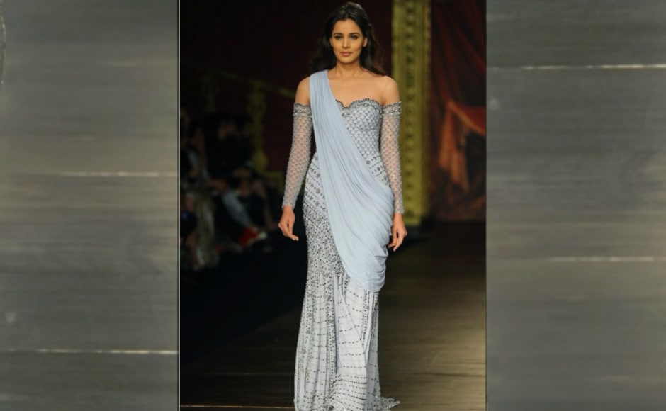 Jaising unfolded her most colossal collection 'Opera' at the fashion gala and the collection shown had a theatrical variation of fabrics composed of lame, velvet metallics, tulle, chikankari, Italian organza, banarasi, metallic satin and much more. Image from <em>News 18.</em> Jaising unfolded her most colossal collection 'Opera' at the fashion gala and the collection shown had a theatrical variation of fabrics composed of lame, velvet metallics, tulle, chikankari, Italian organza, banarasi, metallic satin and much more. Image from <em>News 18.</em>