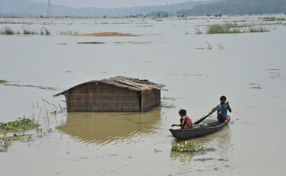 A boy rows a boat past a submerged hut in a flooded field at Mayong village in Morigaon district of Assam. Close to 12 lakh people in 24 districts of Assam continued to reel under floods as the death toll reached 60 in the state on Saturday. Reuters A boy rows a boat past a submerged hut in a flooded field at Mayong village in Morigaon district of Assam. Close to 12 lakh people in 24 districts of Assam continued to reel under floods as the death toll reached 60 in the state on Saturday. Reuters