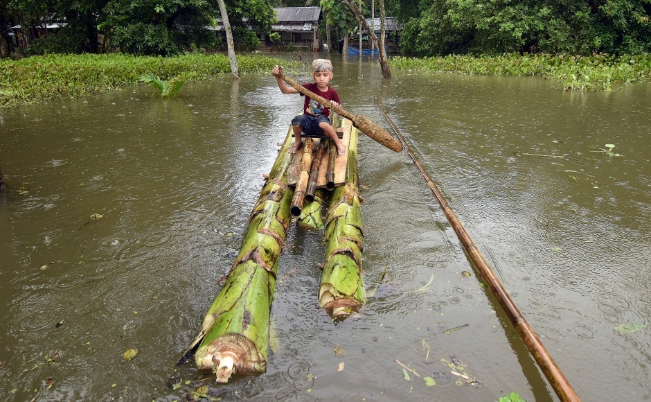 A boy rows a makeshift raft outside his submerged house in the flood-affected Kuthori village near Kaziranga National Park in Nagaon district of Assam. Over 66,516 hectares of agricultural land continue to be affected by floods, a report said. Reuters A boy rows a makeshift raft outside his submerged house in the flood-affected Kuthori village near Kaziranga National Park in Nagaon district of Assam. Over 66,516 hectares of agricultural land continue to be affected by floods, a report said. Reuters