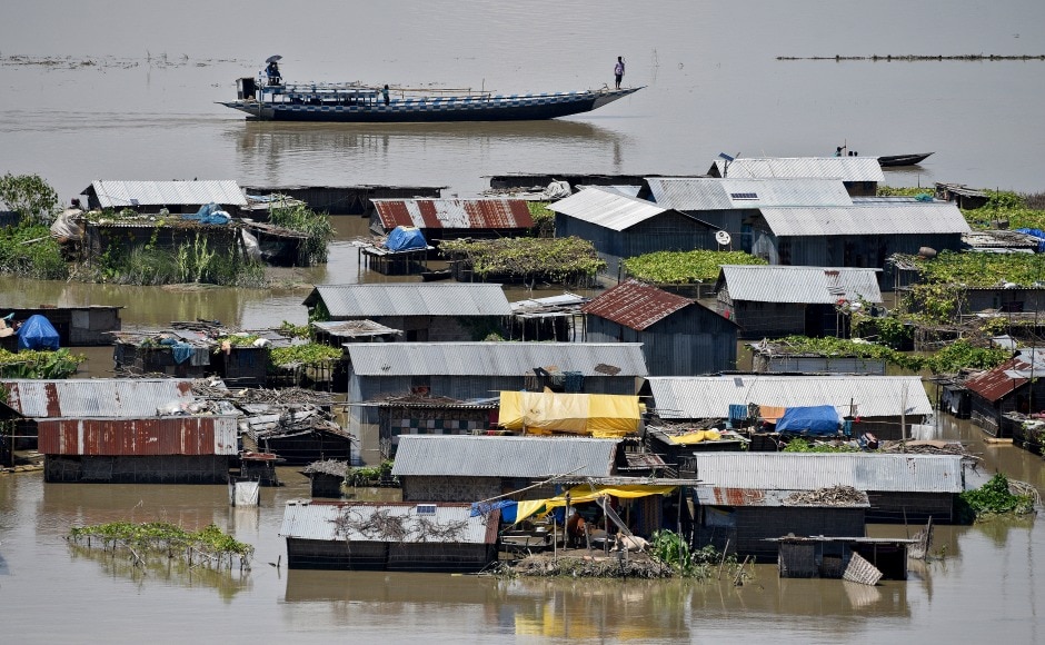 Villagers use a boat as they row past partially submerged houses at a flood-affected village in Morigaon. Due to impact of the flood, many roads, embankments and bridges have been damaged in several districts, including Lakhimpur, Biswanath, Goalpara, Bongaigaon, Dhubri, Golaghat, Majuli, Sivasagar and Karimganj. Reuters Villagers use a boat as they row past partially submerged houses at a flood-affected village in Morigaon. Due to impact of the flood, many roads, embankments and bridges have been damaged in several districts, including Lakhimpur, Biswanath, Goalpara, Bongaigaon, Dhubri, Golaghat, Majuli, Sivasagar and Karimganj. Reuters