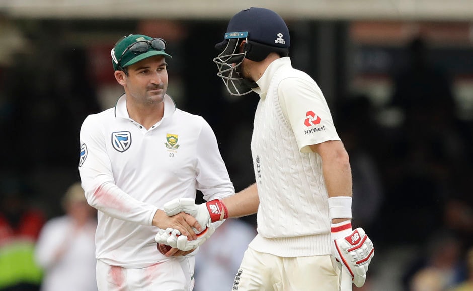 England captain Joe Root(R) shakes hands with South Africa captain Dean Elgar as he walks off at the end of the day's play. AP England captain Joe Root(R) shakes hands with South Africa captain Dean Elgar as he walks off at the end of the day's play. AP