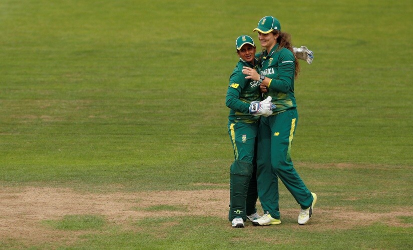 South Africas Laura Wolvaardt (right) celebrates catching Englands Heather Knight. Reuters