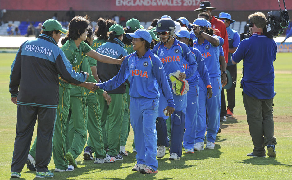 Indian, in blue, and Pakistani cricketers shake hands at the end of the ICC Women's World Cup 2017 match between the two teams that saw India beat Pakistan by 95 runs. AP Indian, in blue, and Pakistani cricketers shake hands at the end of the ICC Women's World Cup 2017 match between the two teams that saw India beat Pakistan by 95 runs. AP