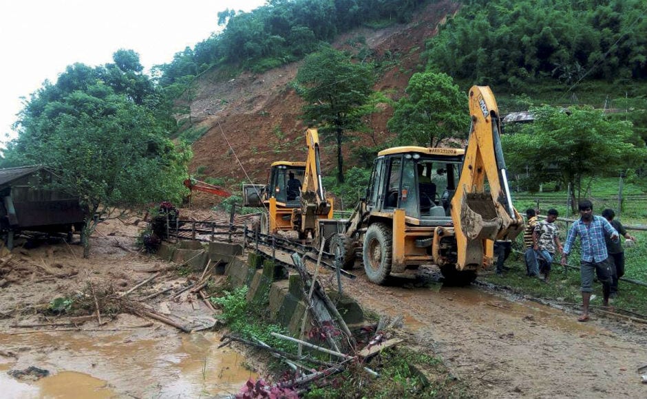 Fourteen people are feared dead in a massive landslide triggered by incessant rains in Arunachal Pradesh's Papum Pare district on Tuesday. PTI Fourteen people are feared dead in a massive landslide triggered by incessant rains in Arunachal Pradesh's Papum Pare district on Tuesday. PTI