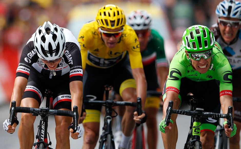 Colombia's Rigoberto Uran(R) crosses the finish line ahead of ahead of France's Warren Barguil(L), Britain's Chris Froome, wearing the overall leader's yellow jersey to win the ninth stage of the Tour de France cycling race. AP Colombia's Rigoberto Uran(R) crosses the finish line ahead of ahead of France's Warren Barguil(L), Britain's Chris Froome, wearing the overall leader's yellow jersey to win the ninth stage of the Tour de France cycling race. AP