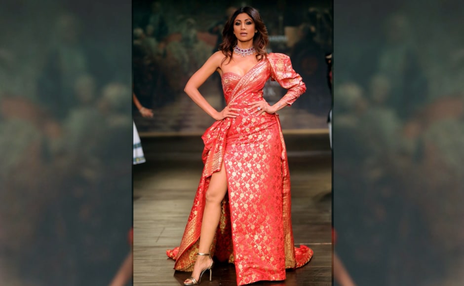 Draped in exquisite Benarasi silk brocade with golden weaves to add flair, actor Shilpa Shetty grabbed eyeballs when she walked the ramp as Monisha Jaising's showstopper. Image from <em>News 18</em>. Draped in exquisite Benarasi silk brocade with golden weaves to add flair, actor Shilpa Shetty grabbed eyeballs when she walked the ramp as Monisha Jaising's showstopper. Image from <em>News 18</em>.