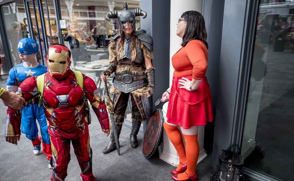 Cosplayers dressed as (L-R) Captain America, Ironman, Dragonborn and Velma attend London Super Comic Convention. AFP PHOTO Cosplayers dressed as (L-R) Captain America, Ironman, Dragonborn and Velma attend London Super Comic Convention. AFP PHOTO