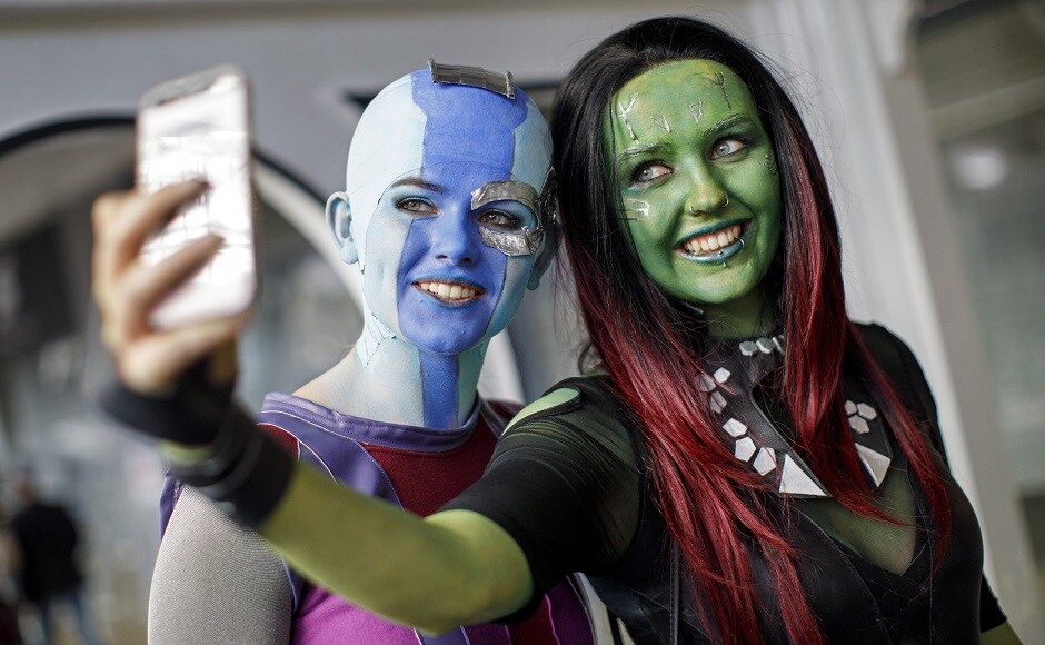 Cosplayers dressed as Nebula and Gamora from Guardians of the Galaxy pose for a selfie photograph as they attend London Super Comic Convention. AFP PHOTO Cosplayers dressed as Nebula and Gamora from Guardians of the Galaxy pose for a selfie photograph as they attend London Super Comic Convention. AFP PHOTO