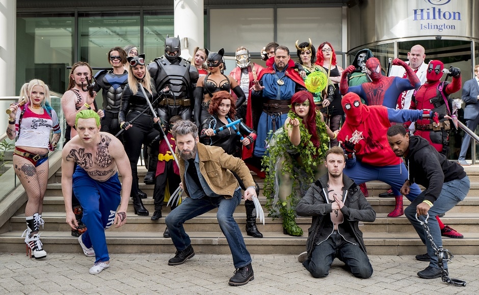 Cosplayers dressed as DC Universe characters pose for photographers as they attend London Super Comic Convention. AFP PHOTO Cosplayers dressed as DC Universe characters pose for photographers as they attend London Super Comic Convention. AFP PHOTO
