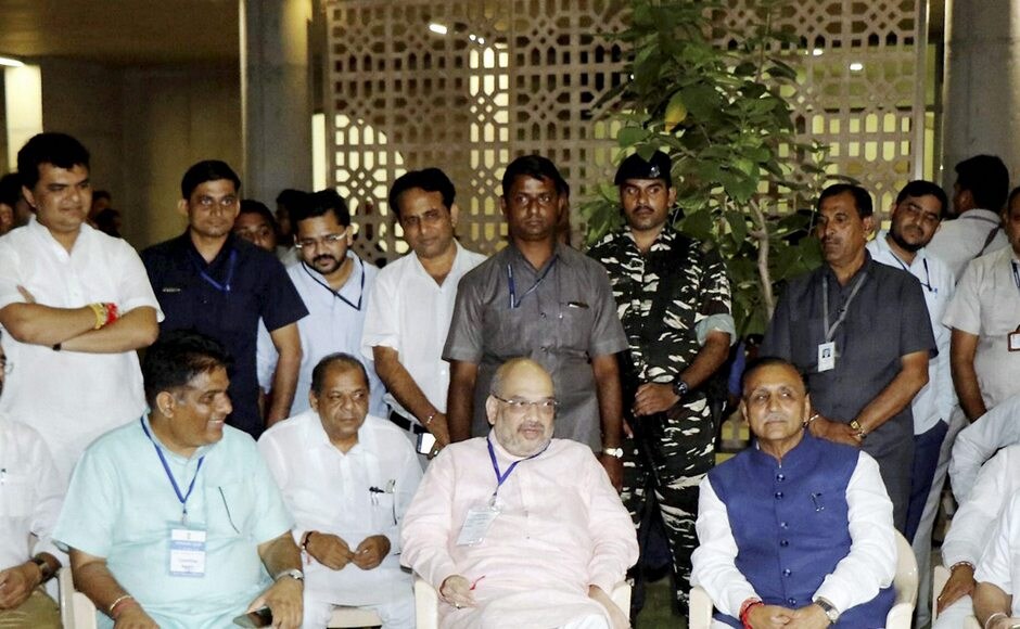 Shah with Gujarat chief minister Vijay Rupani and MLAs outside the counting centre of Rajya Sabha election at Gandhinagar on Tuesday. PTI Shah with Gujarat chief minister Vijay Rupani and MLAs outside the counting centre of Rajya Sabha election at Gandhinagar on Tuesday. PTI