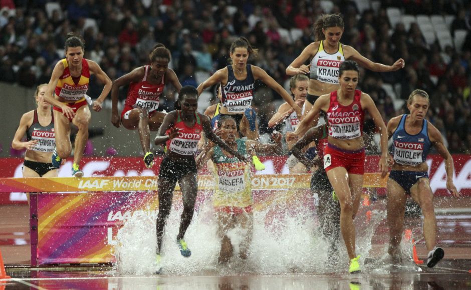 Athletes clear the water jump in a women's 3000-metre steeplechase first round heat during the IAAF World Championships in London. AP Athletes clear the water jump in a women's 3000-metre steeplechase first round heat during the IAAF World Championships in London. AP