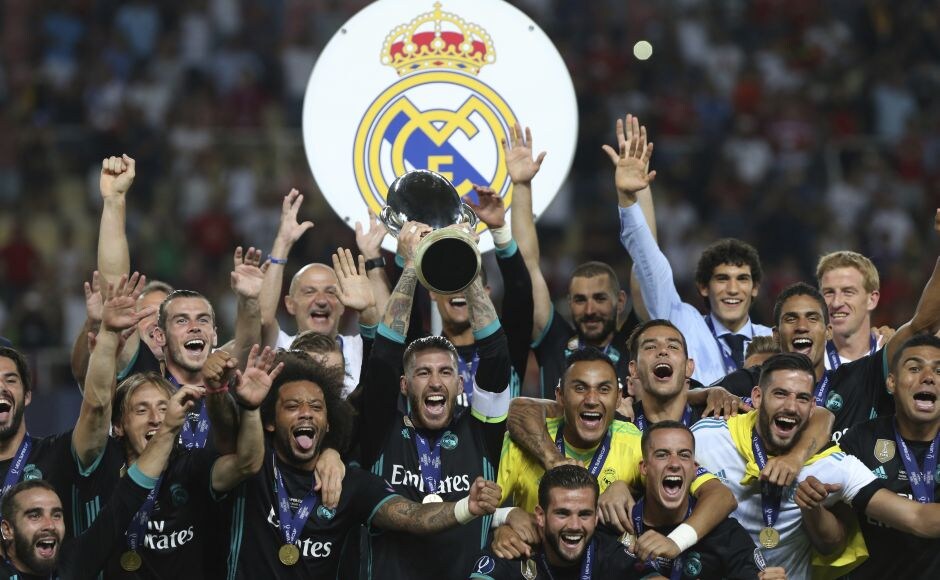 Real Madrid celebrate with the trophy after defeating Manchester United in the UEFA Super Cup final soccer match at Philip II Arena in Skopje. AP Real Madrid celebrate with the trophy after defeating Manchester United in the UEFA Super Cup final soccer match at Philip II Arena in Skopje. AP
