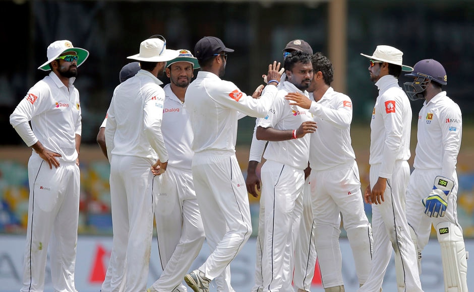 Sri Lanka's Malinda Pushpakumara too scalped his maiden Test wicket dismissing India's Ajinkya Rahane stumped. AP Sri Lanka's Malinda Pushpakumara too scalped his maiden Test wicket dismissing India's Ajinkya Rahane stumped. AP