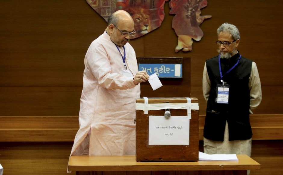 BJP national president Amit Shah casts his vote for Rajya Sabha election at the Secretariat in Gandhinagar on Tuesday. PTI BJP national president Amit Shah casts his vote for Rajya Sabha election at the Secretariat in Gandhinagar on Tuesday. PTI