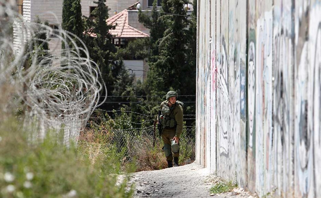 Israel began building the barrier a decade ago, at the height of an armed Palestinian uprising, saying the divider is needed to keep suicide bombers and gunmen from entering Israel. Palestinians say the barrier, which slices off about 10 percent of the West Bank, amounts to a land grab. AP Israel began building the barrier a decade ago, at the height of an armed Palestinian uprising, saying the divider is needed to keep suicide bombers and gunmen from entering Israel. Palestinians say the barrier, which slices off about 10 percent of the West Bank, amounts to a land grab. AP