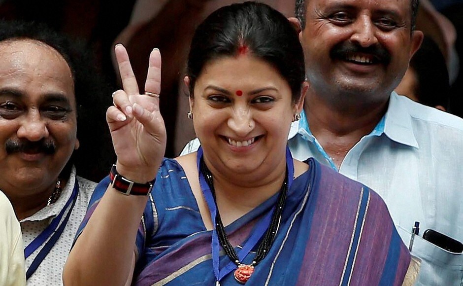 Union Textiles Minister Smriti Irani flashes victory sign after casting her vote in Gujarat Rajya Sabha election, in Gandhinagar on Tuesday. PTI Union Textiles Minister Smriti Irani flashes victory sign after casting her vote in Gujarat Rajya Sabha election, in Gandhinagar on Tuesday. PTI