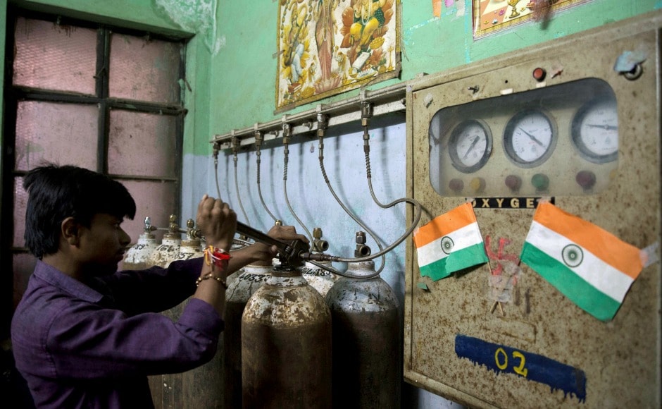 A hospital staff member checks newly arrived oxygen cylinders at Baba Raghav Das Medical College Hospital in Gorakhpur. District magistrate Rajiv Rautela said on Saturday that the deaths of the children being treated for different ailments were due to natural causes. He denied that an insufficient oxygen supply led to their deaths. AP A hospital staff member checks newly arrived oxygen cylinders at Baba Raghav Das Medical College Hospital in Gorakhpur. District magistrate Rajiv Rautela said on Saturday that the deaths of the children being treated for different ailments were due to natural causes. He denied that an insufficient oxygen supply led to their deaths. AP