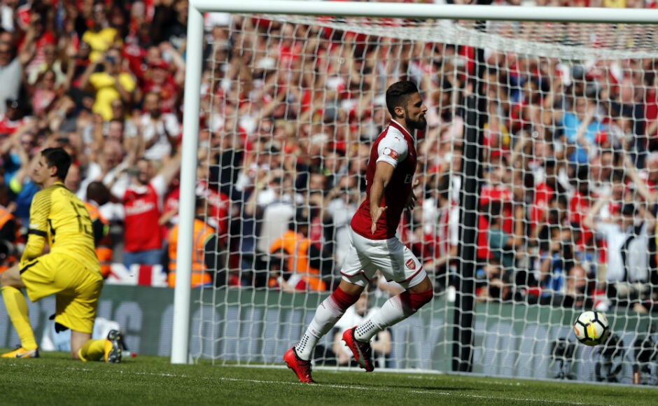 Arsenal's Olivier Giroud, center, celebrates after scoring by the last penalty to clinch the title. AP Arsenal's Olivier Giroud, center, celebrates after scoring by the last penalty to clinch the title. AP