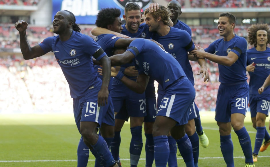 Chelsea's Victor Moses, left, celebrates with teammates after scoring his side's first goal. AP Chelsea's Victor Moses, left, celebrates with teammates after scoring his side's first goal. AP