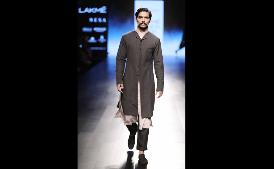He also brought in a lot of asymmetry in his costumes, their cuts and silhouettes. Short coats had interesting small lapels, baggy trousers and <em>kurtas</em> were often teamed with lapel coats. Knit<em> sherwanis,</em> collarless shirts and shawl collar jackets were the centre of attraction in the men's range. He also brought in a lot of asymmetry in his costumes, their cuts and silhouettes. Short coats had interesting small lapels, baggy trousers and <em>kurtas</em> were often teamed with lapel coats. Knit<em> sherwanis,</em> collarless shirts and shawl collar jackets were the centre of attraction in the men's range.