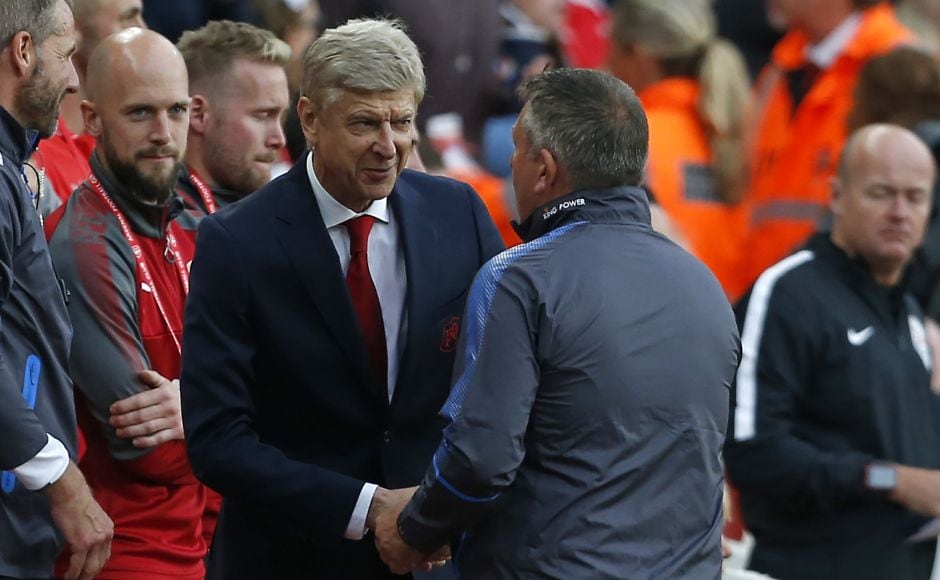 Arsenal's French manager Arsene Wenger (centre left) and Leicester City's English manager Craig Shakespeare shake hands ahead of the Premier League match between Arsenal and Leicester City at the Emirates Stadium in London. AFP Arsenal's French manager Arsene Wenger (centre left) and Leicester City's English manager Craig Shakespeare shake hands ahead of the Premier League match between Arsenal and Leicester City at the Emirates Stadium in London. AFP
