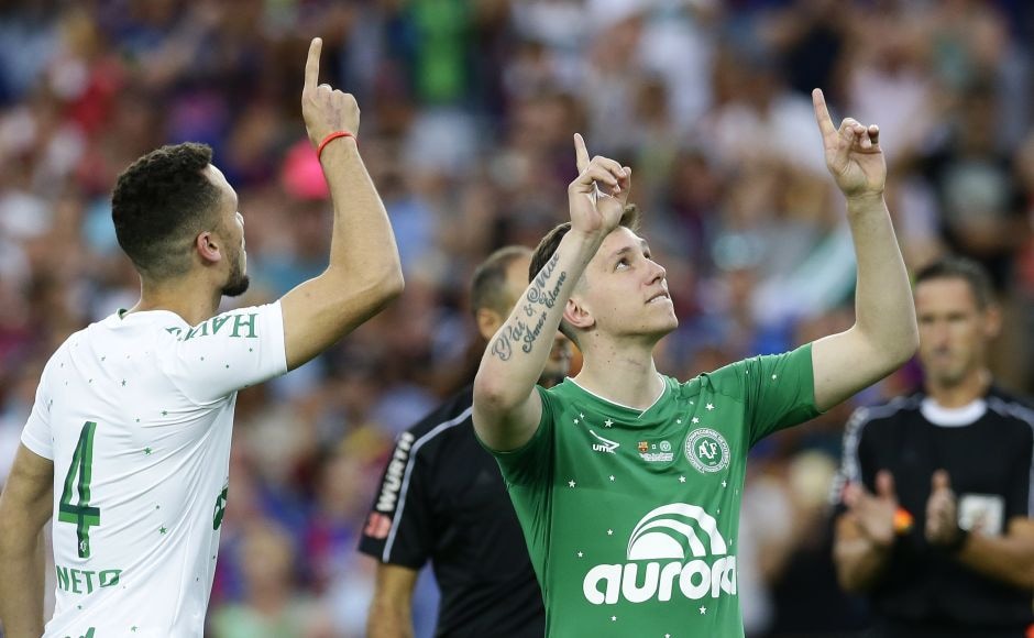 Follmann and Neto shared in a moving honorary kickoff. Follmann, who had part of his right leg amputated from injuries in the crash, was wearing a prosthetic leg when he took the kickoff along with Neto. Neto, who played in the friendly, accompanied Follmann to the bench as they both received another wave of applause. AP Follmann and Neto shared in a moving honorary kickoff. Follmann, who had part of his right leg amputated from injuries in the crash, was wearing a prosthetic leg when he took the kickoff along with Neto. Neto, who played in the friendly, accompanied Follmann to the bench as they both received another wave of applause. AP