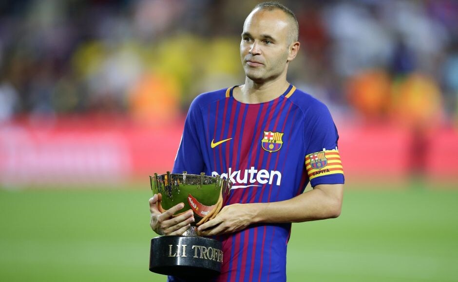 Barcelona's Andres Iniesta holds the Joan Gamper trophy after the match. In an emotional night at Camp Nou, the match was more about overcoming the terrible tragedy that had shaken Chapecoense than a warm-up game for the Catalan club. AP Barcelona's Andres Iniesta holds the Joan Gamper trophy after the match. In an emotional night at Camp Nou, the match was more about overcoming the terrible tragedy that had shaken Chapecoense than a warm-up game for the Catalan club. AP