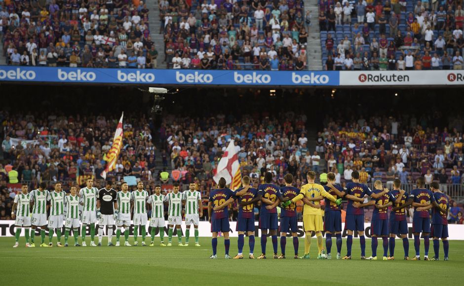 Barcelona and Betis's football players observe a minute of silence as they wear jerseys reading "Barcelona" instead of their names to pay tribute to the victims of the Barcelona and Cambrils attacks before their match at the Camp Nou. AFP Barcelona and Betis's football players observe a minute of silence as they wear jerseys reading "Barcelona" instead of their names to pay tribute to the victims of the Barcelona and Cambrils attacks before their match at the Camp Nou. AFP