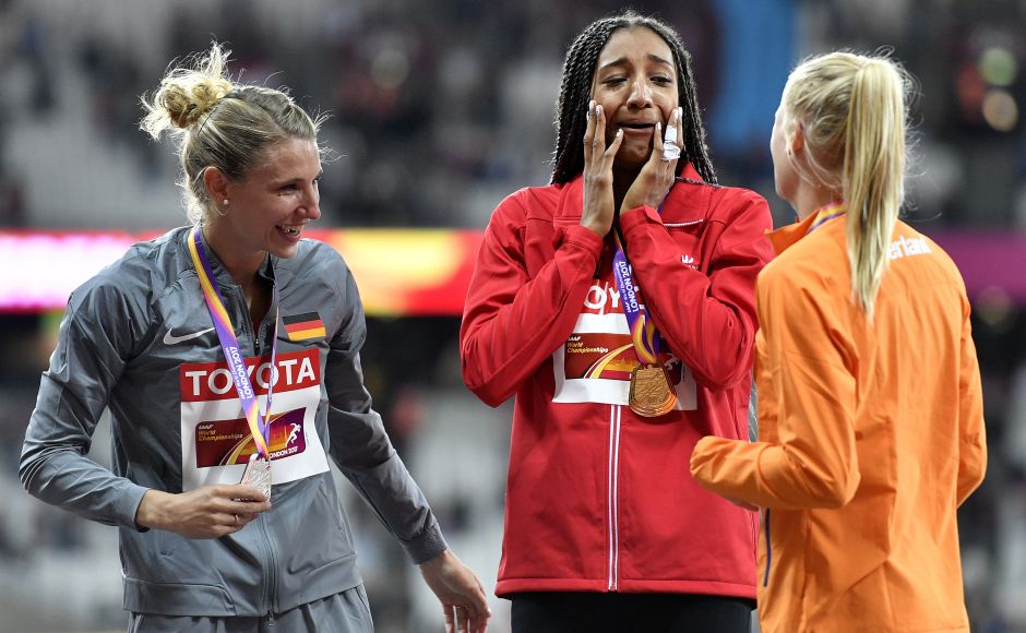 Belgium's Nafissatou Thiam, centre, celebrates on the podium after receiving her gold medal for the heptathlon with silver medalist Germany's Carolin Schaefer, left, and bronze medalist Netherlands' Anouk Vetter, right, at the World Athletics Championships in London on Sunday. AP Belgium's Nafissatou Thiam, centre, celebrates on the podium after receiving her gold medal for the heptathlon with silver medalist Germany's Carolin Schaefer, left, and bronze medalist Netherlands' Anouk Vetter, right, at the World Athletics Championships in London on Sunday. AP