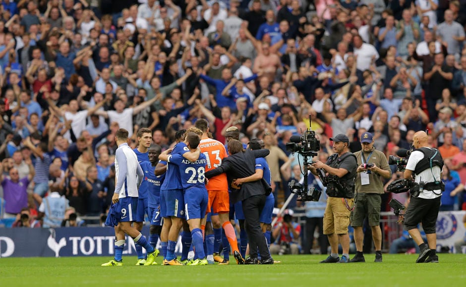 Chelsea team and manager Antonio Conte celebrate in front of their fans after securing their first win of the 2017/18 campaign. It was Tottenham's first match at their new home Wembley Stadium. AP Chelsea team and manager Antonio Conte celebrate in front of their fans after securing their first win of the 2017/18 campaign. It was Tottenham's first match at their new home Wembley Stadium. AP