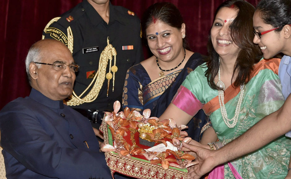 A delegation of 116 women and 27 men, representing the Koli Samaj, tied the traditional rakhi on the hands of the president. PTI A delegation of 116 women and 27 men, representing the Koli Samaj, tied the traditional rakhi on the hands of the president. PTI