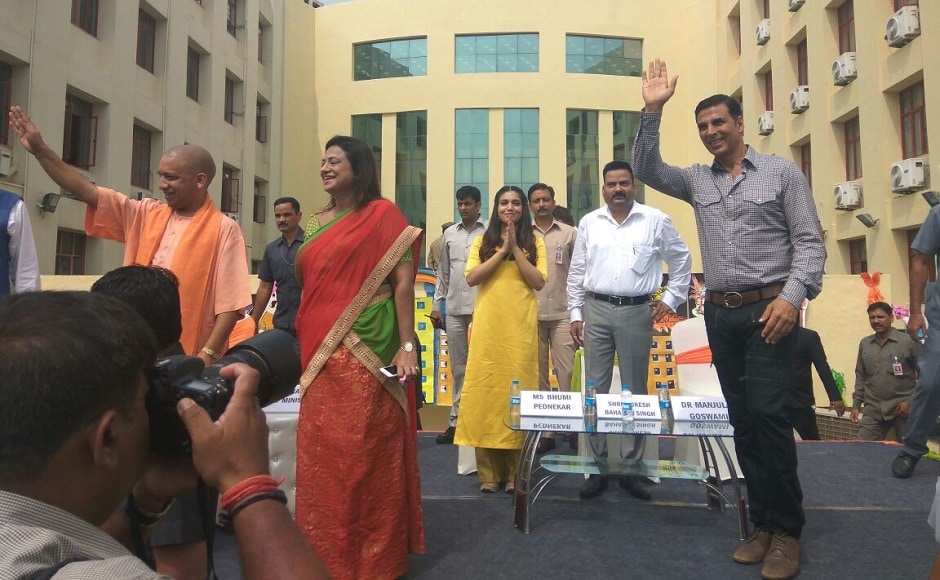 Akshay Kumar, Yogi Adityanath and Bhumi Pednekar wave at people present at the event. Image from Twitter Akshay Kumar, Yogi Adityanath and Bhumi Pednekar wave at people present at the event. Image from Twitter