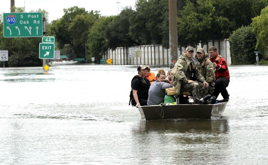 National Guard troops, police officers, rescue workers and civilians raced in helicopters, boats and special high-water trucks to rescue the hundreds of people still stranded in and around Houston. AP National Guard troops, police officers, rescue workers and civilians raced in helicopters, boats and special high-water trucks to rescue the hundreds of people still stranded in and around Houston. AP